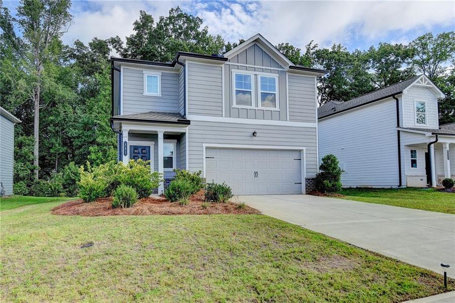 Front exterior of a new home in , Braselton, GA, highlighting curb appeal (Image 29).