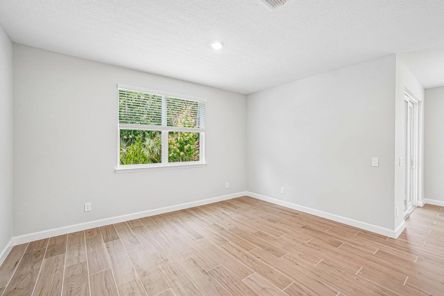 The family room is located off the kitchen and features a double window for excellent lighting The family room is located off the kitchen and features a double window for excellent lighting