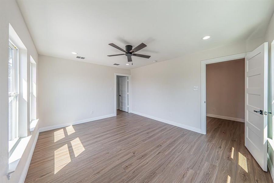 Unfurnished room with light wood-style flooring, recessed lighting, and ceiling fan Unfurnished room with light wood-style flooring, recessed lighting, and ceiling fan