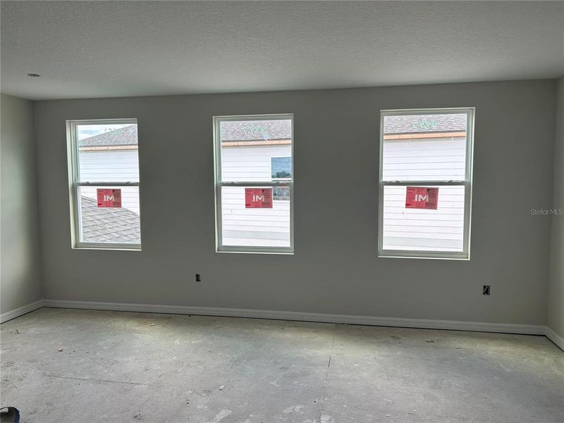 In-progress construction of a new home in Oakfield Trails Signature, Parrish, FL (Image 19).