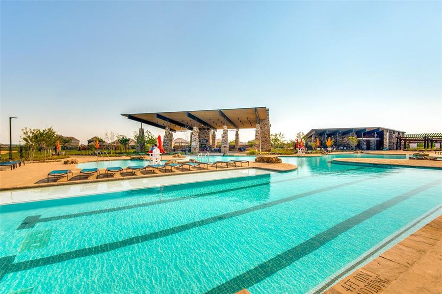 View of community pool with a patio area