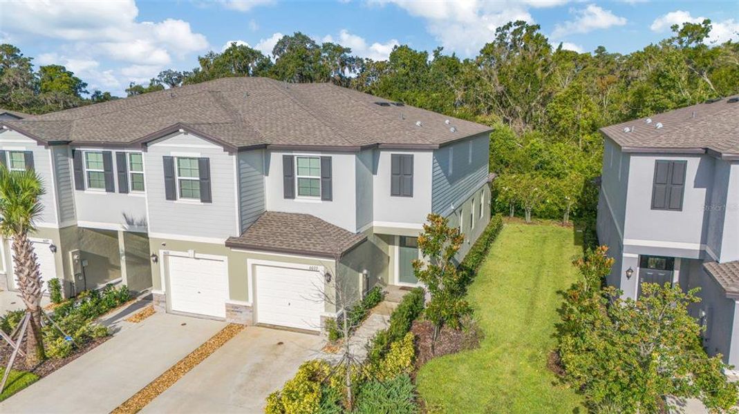 Front exterior of a new home in , Land O' Lakes, FL, highlighting curb appeal (Image 21).