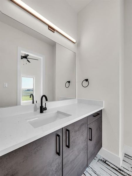 Bathroom featuring vanity and ceiling fan