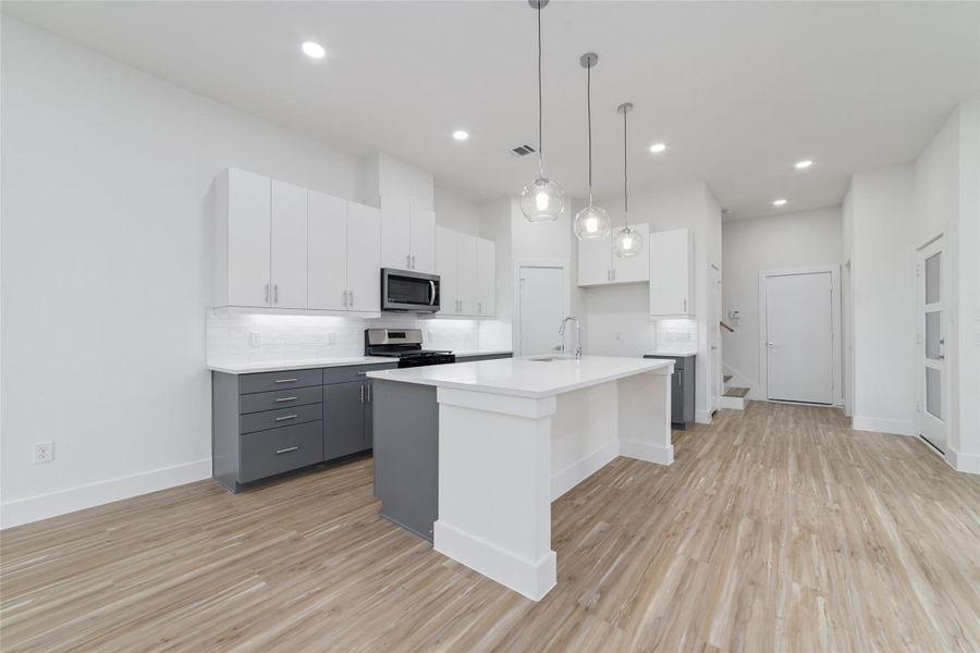 Stunning Light Features Showcasing the HUGE Kitchen Island