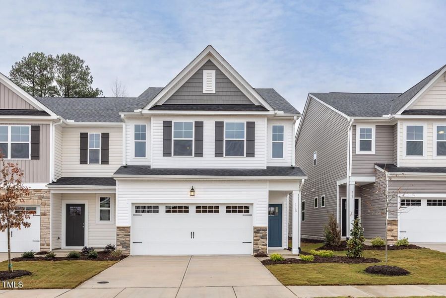 Front exterior of a new home in Gregory Village Townhomes, Lillington, NC, highlighting curb appeal (Image 51).