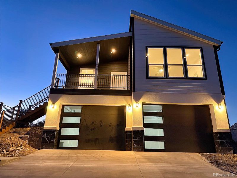 Evening view showcasing designer lighting and curb appeal. Evening view showcasing designer lighting and curb appeal.