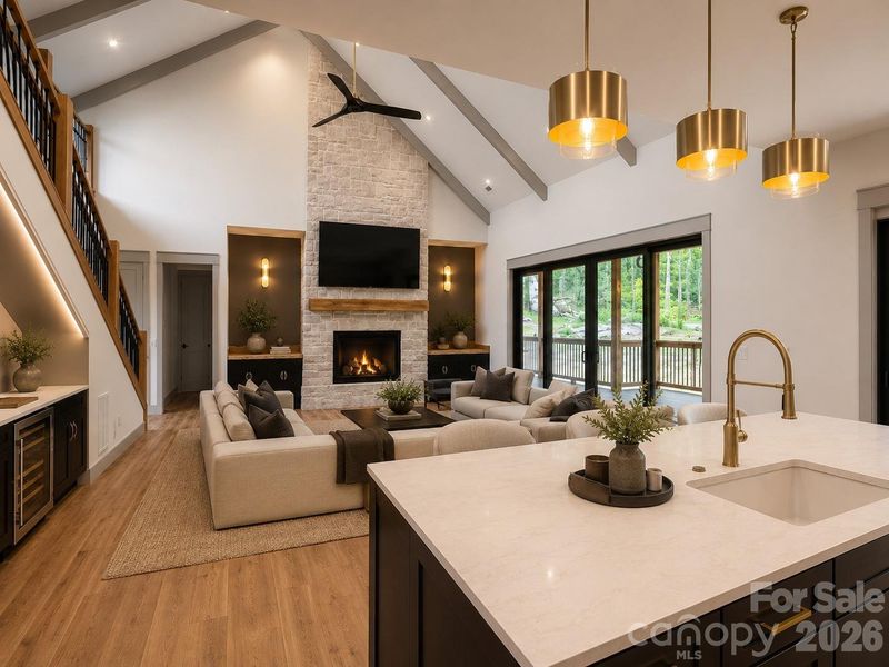 Vaulted great room with floor-to-ceiling stone fireplace and expansive sliding glass doors. Virtually Staged.