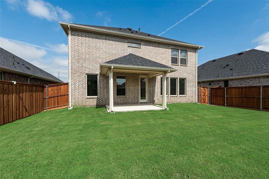 Exterior details and patio area of a home in Spiritas Ranch, Little Elm (Image 20).