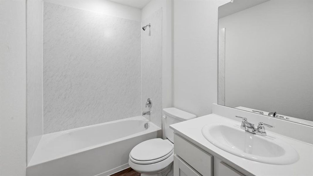 Full bath featuring vanity and tub / shower combination