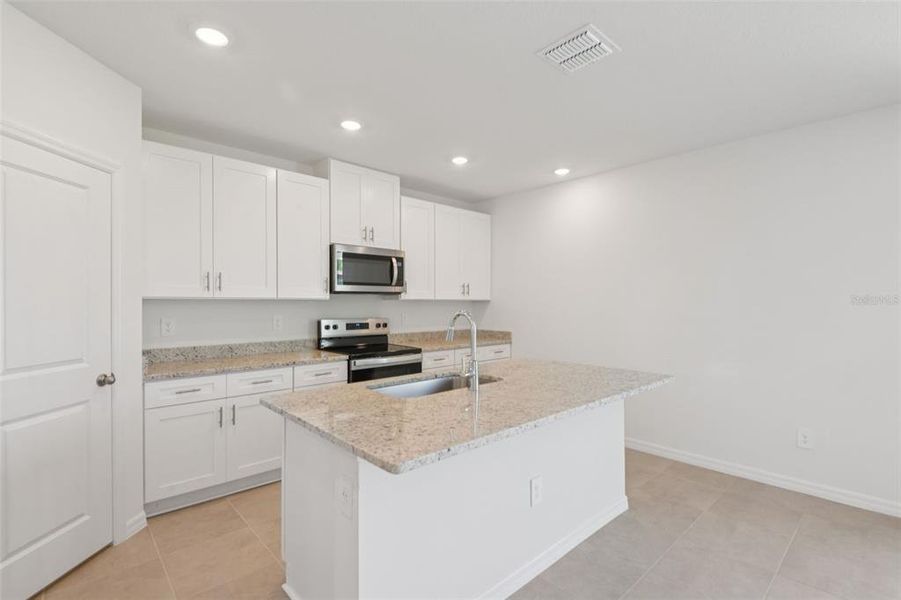 Furnished interior view inside a new home in Hilltop Vistas, Dade City (Image 13).