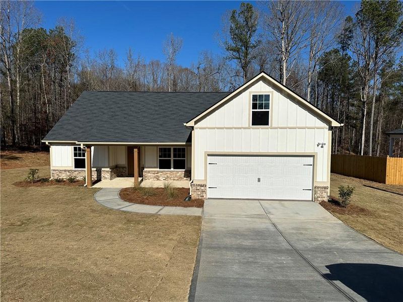 Front exterior of a new home in , Covington, GA, highlighting curb appeal (Image 1). Front exterior of a new home in , Covington, GA, highlighting curb appeal (Image 1).