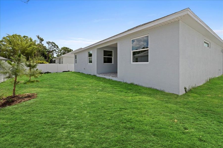 Front exterior of a new home in , North Port, FL, highlighting curb appeal (Image 2). Front exterior of a new home in , North Port, FL, highlighting curb appeal (Image 2).