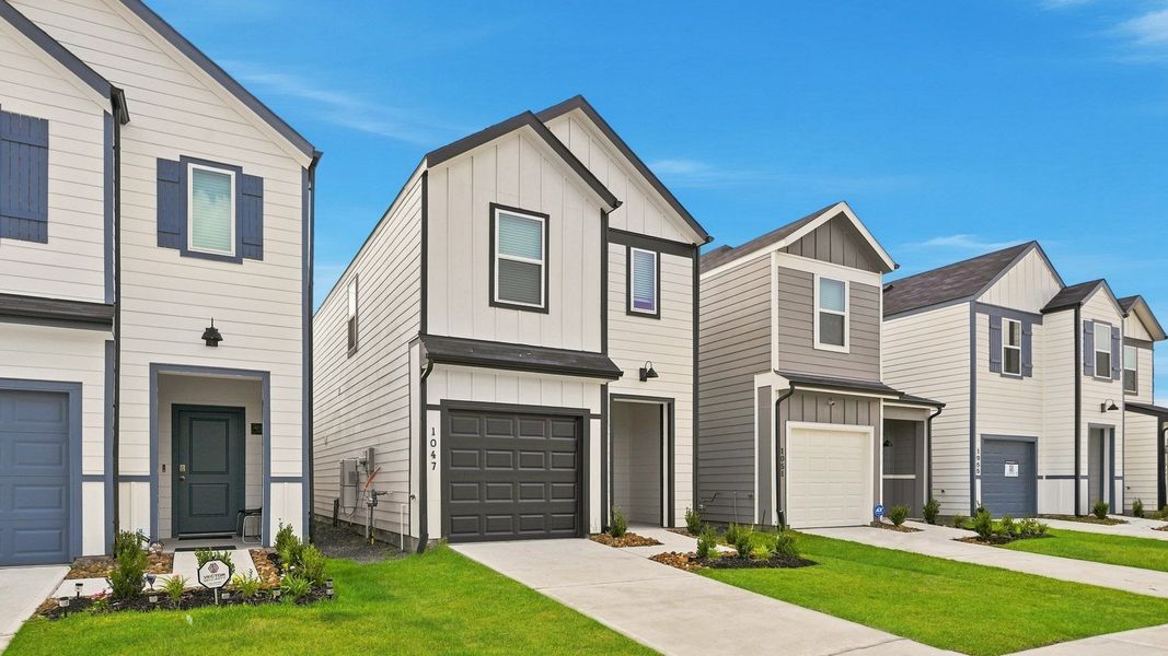 Front exterior of a new home in The Villas at Legacy Park, Houston, TX, highlighting curb appeal (Image 6). Front exterior of a new home in The Villas at Legacy Park, Houston, TX, highlighting curb appeal (Image 6).