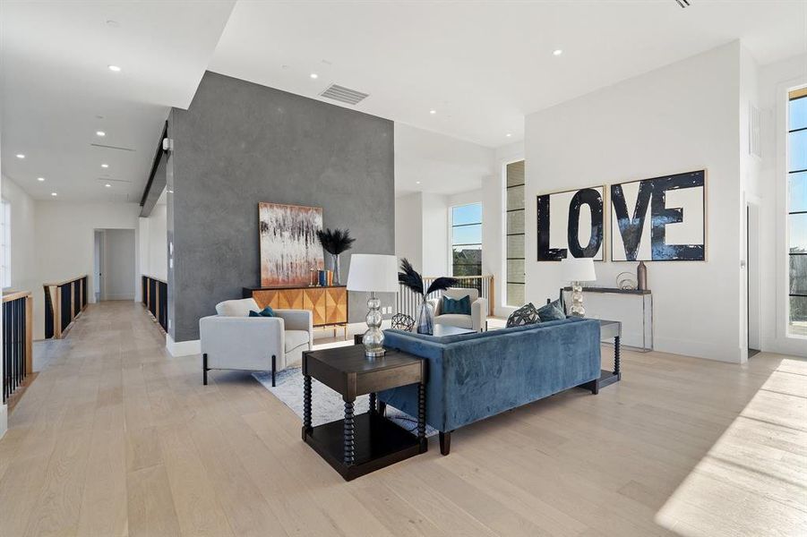 Living room with light hardwood / wood-style flooring