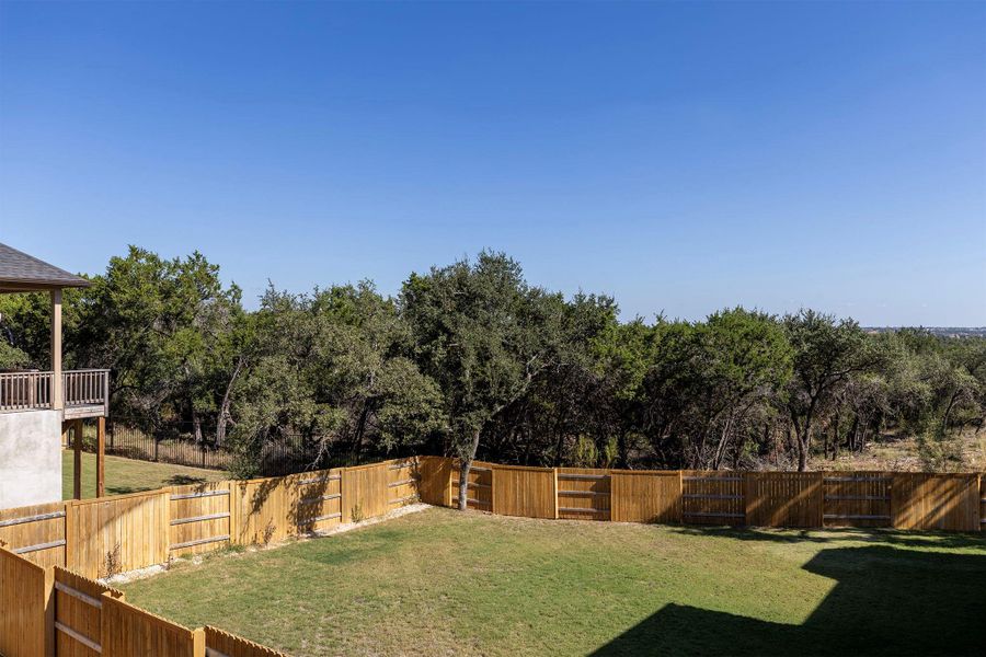 View of fenced backyard