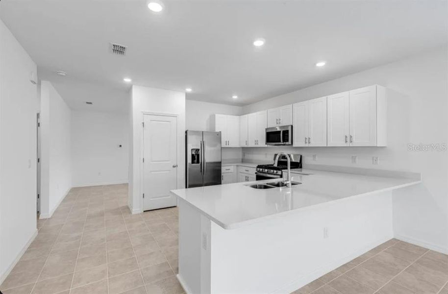 Furnished interior view inside a new home in Coasterra Community Group Page, Palmetto (Image 3).