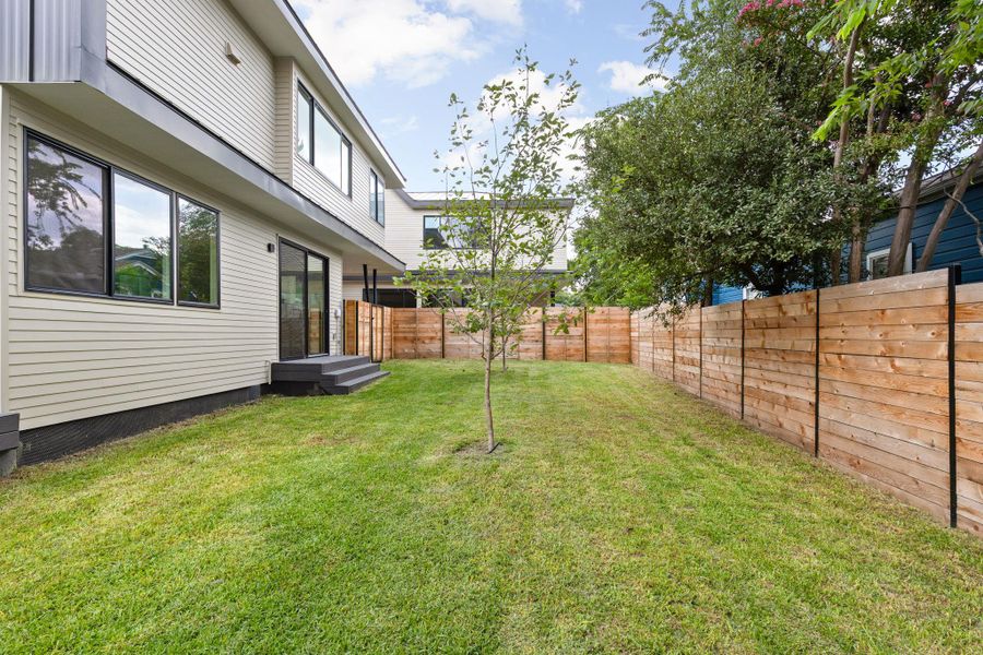 View of fenced backyard