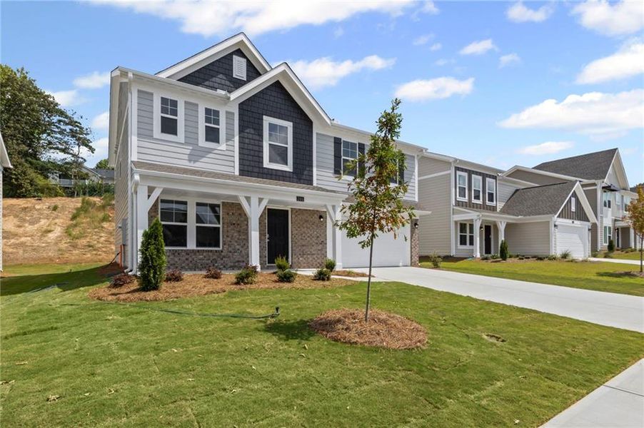 Front exterior of a new home in Sage Woods, Dallas, GA, highlighting curb appeal (Image 20). Front exterior of a new home in Sage Woods, Dallas, GA, highlighting curb appeal (Image 20).