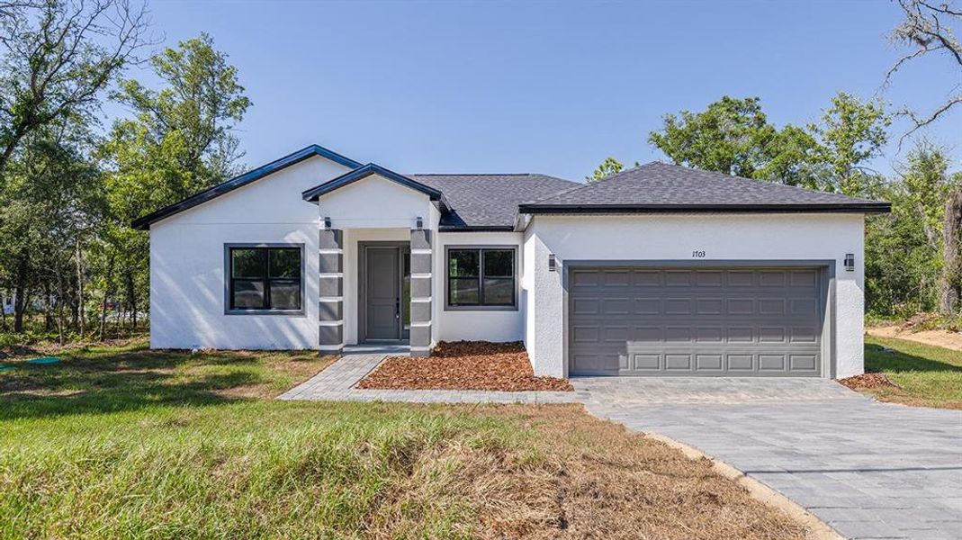Front exterior of a new home in , Citrus Springs, FL, highlighting curb appeal (Image 1). Front exterior of a new home in , Citrus Springs, FL, highlighting curb appeal (Image 1).