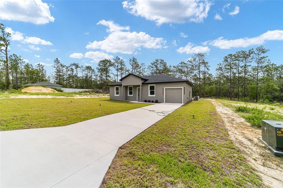 Front exterior of a new home in , Dunnellon, FL, highlighting curb appeal (Image 22). Front exterior of a new home in , Dunnellon, FL, highlighting curb appeal (Image 22).