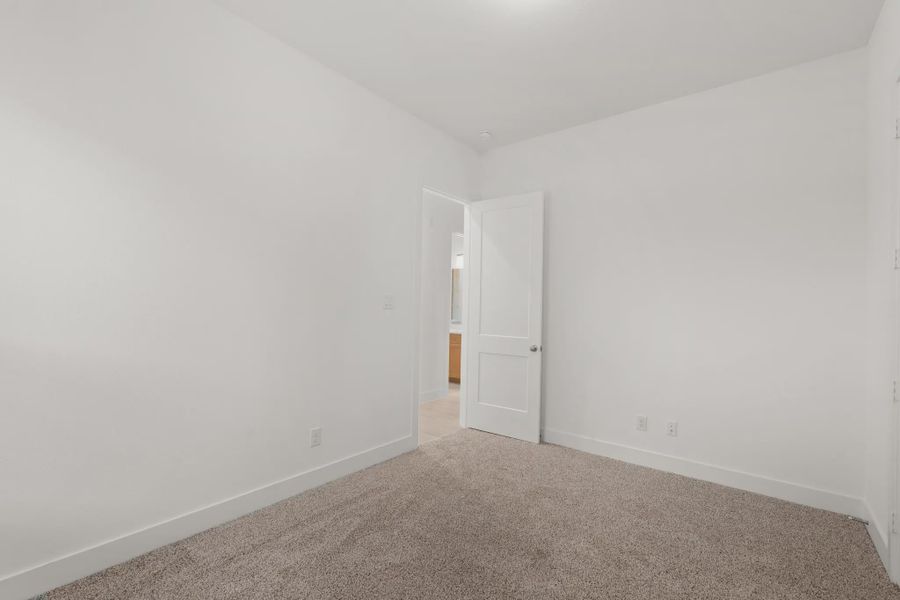 Representative unfurnished interior of a home built from the Mickelson by Chesmar Homes in Riceland Alley Loads, Mont Belvieu (Image 98).
