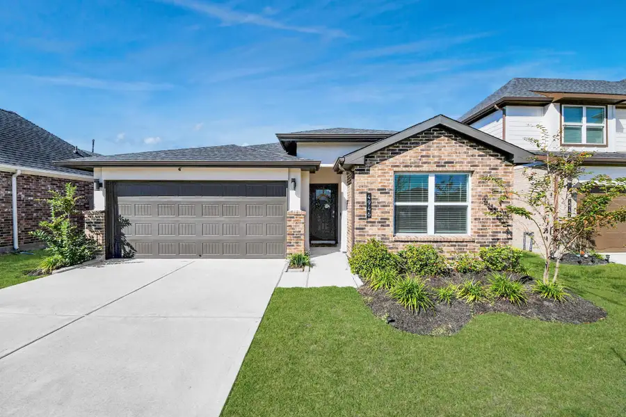 Front exterior of a new home in Post Oak Pointe, Fresno, TX, highlighting curb appeal (Image 2).