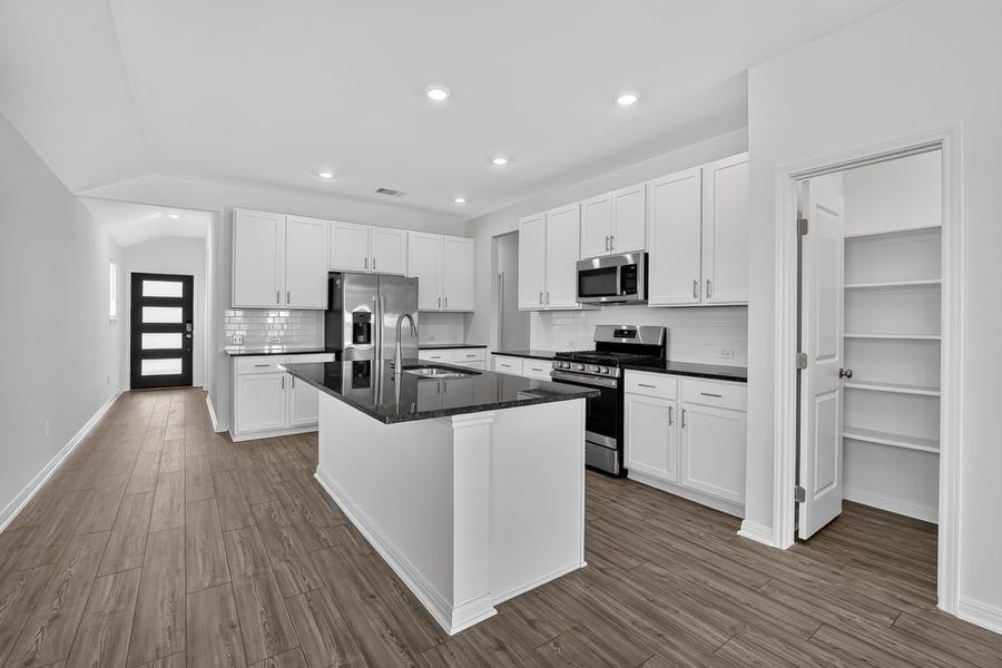 Representative furnished interior of a home built from the Falcon by Taylor Morrison in Stonewall Ranch, Liberty Hill (Image 5).