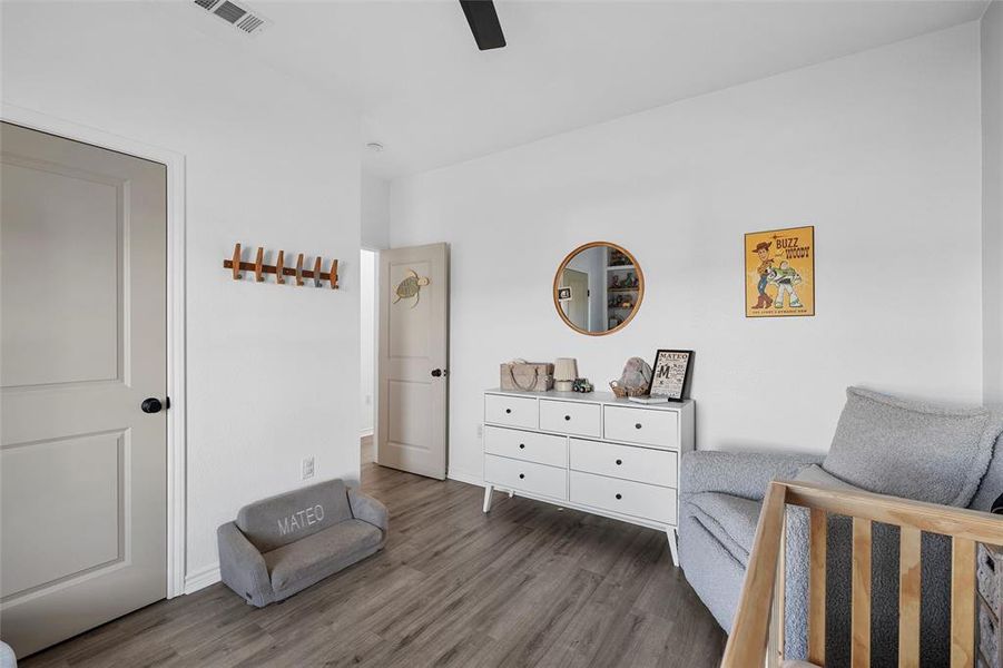 Sitting room featuring wood finished floors and ceiling fan