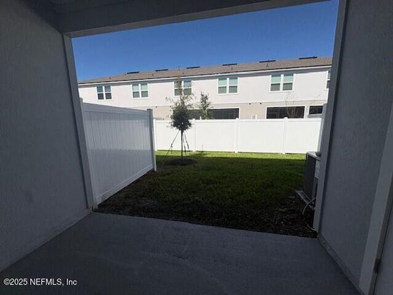 Exterior details and patio area of a home in Cordera Townhomes Express, St. Augustine (Image 24).