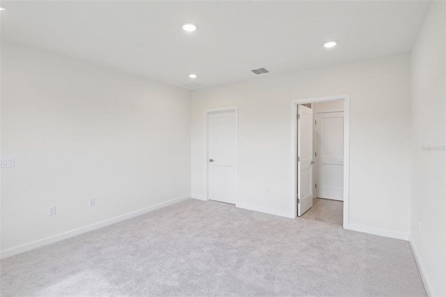 Spacious, unfurnished interior of a new home in Grasslands West, Lakeland (Image 23).
