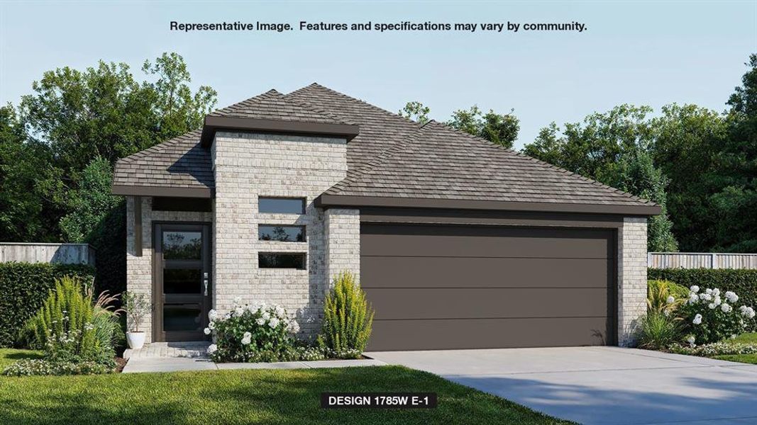 View of front of home with a garage and a front lawn