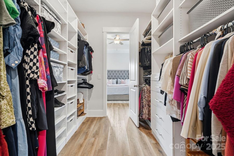 Primary closet with upgraded custom closet organizer