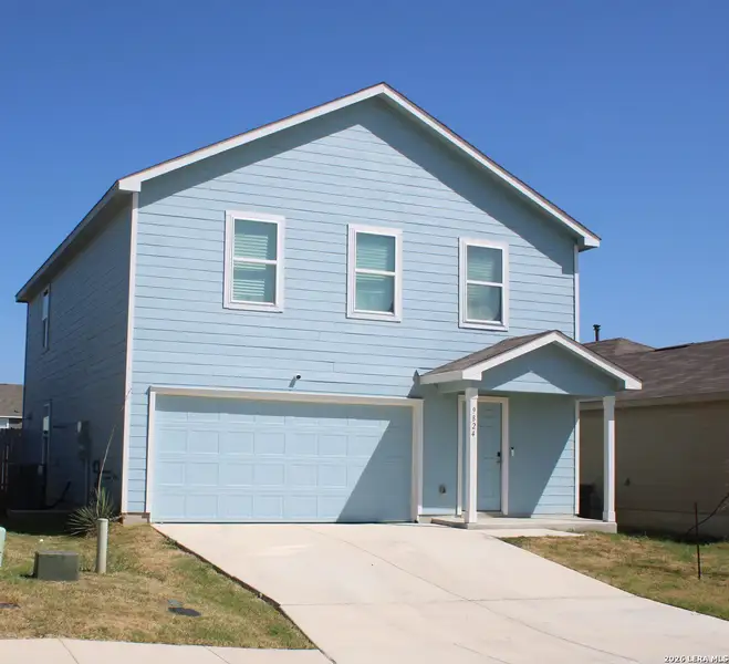 Front exterior of a new home in Waterwheel, San Antonio, TX, highlighting curb appeal (Image 2).