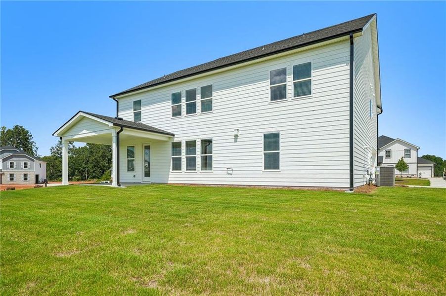 Exterior details and patio area of a home in River Pointe, Monroe (Image 26).