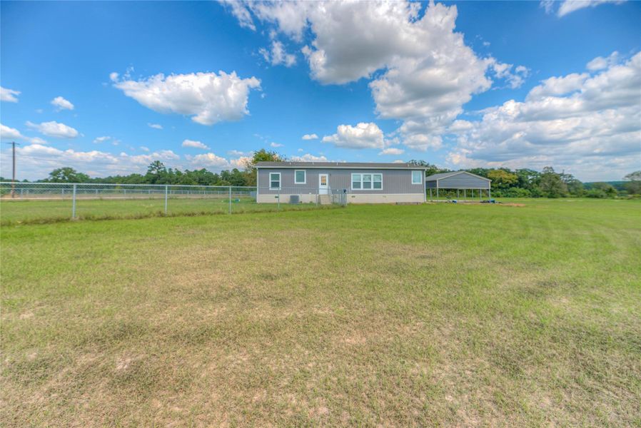 Chain link fence connected to home for your fury friends!