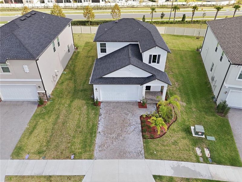 Front exterior of a new home in Stonegate Preserve, Palmetto, FL, highlighting curb appeal (Image 27).
