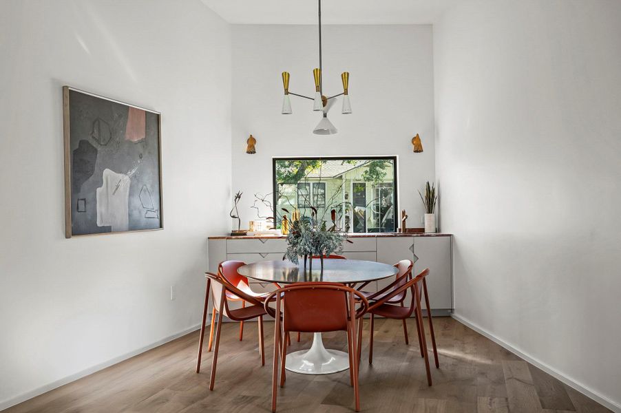 Dining room with mid century chandelier and wet bar