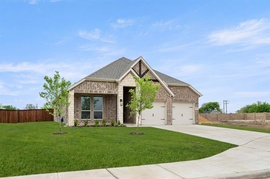Front exterior of a new home in Westside Preserve, Midlothian, TX, highlighting curb appeal (Image 2).