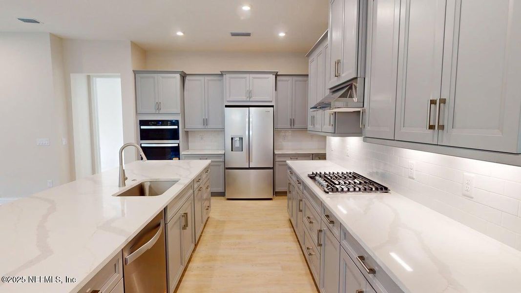 Furnished interior view inside a new home in RiverTown - WaterSong, St. Johns (Image 3).