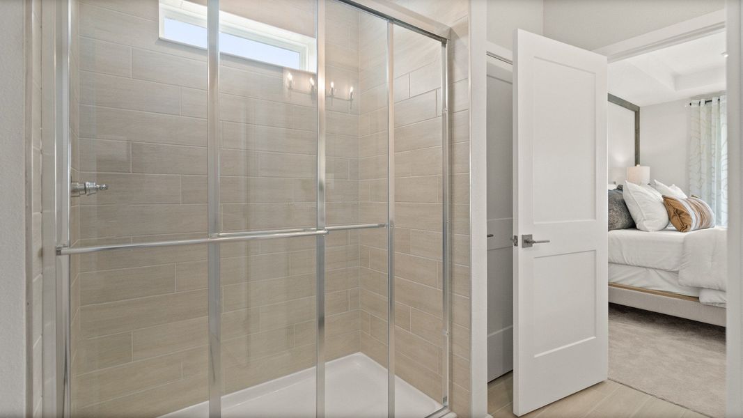 Contemporary Primary En Suite Bath with in this New Construction Home in Winter Haven by DRB Homes in Willowbrook North