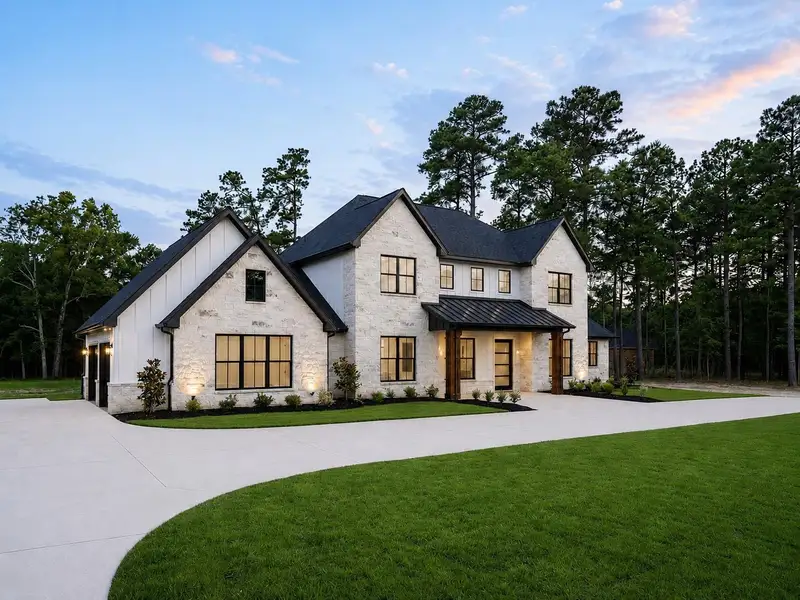 Ocean blue stone exterior paired with Hardie board accents, designer exterior sconces and soffit, fascia, and landscape lighting for striking curb appeal. Ocean blue stone exterior paired with Hardie board accents, designer exterior sconces and soffit, fascia, and landscape lighting for striking curb appeal.