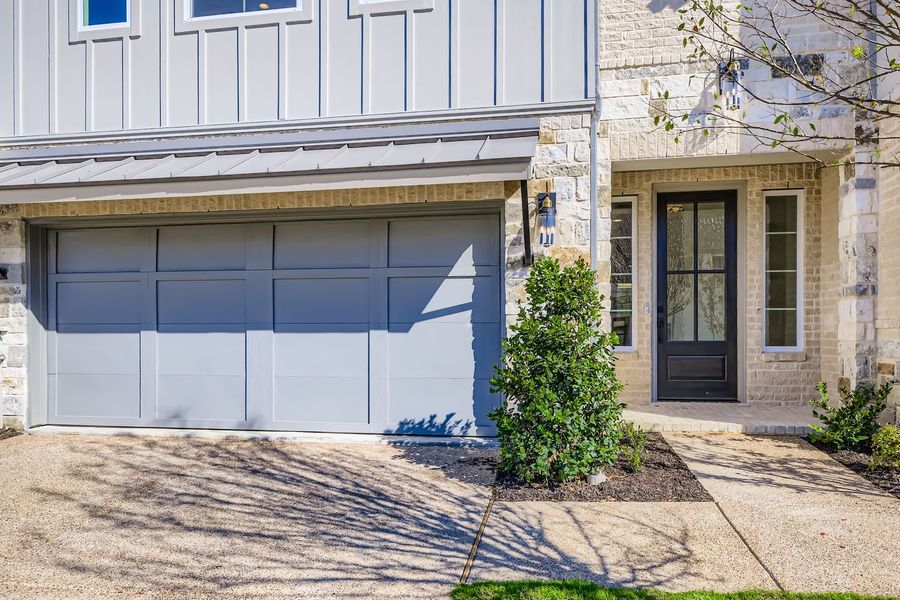 Exterior details and patio area of a home in Castle Hills Northpointe - Townhomes, Carrollton (Image 3). Exterior details and patio area of a home in Castle Hills Northpointe - Townhomes, Carrollton (Image 3).