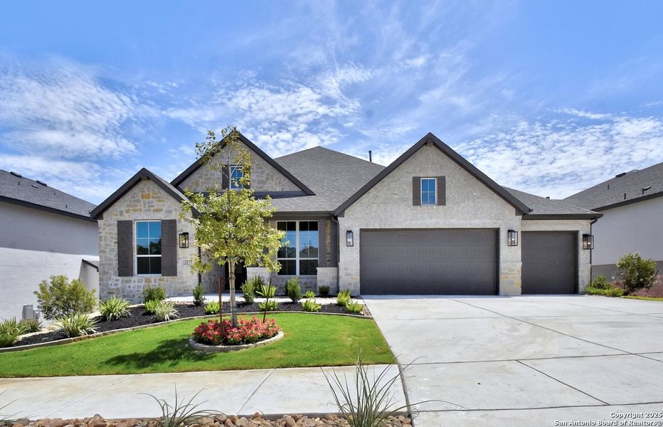 Front exterior of a new home in Esperanza, Boerne, TX, highlighting curb appeal (Image 1). Front exterior of a new home in Esperanza, Boerne, TX, highlighting curb appeal (Image 1).