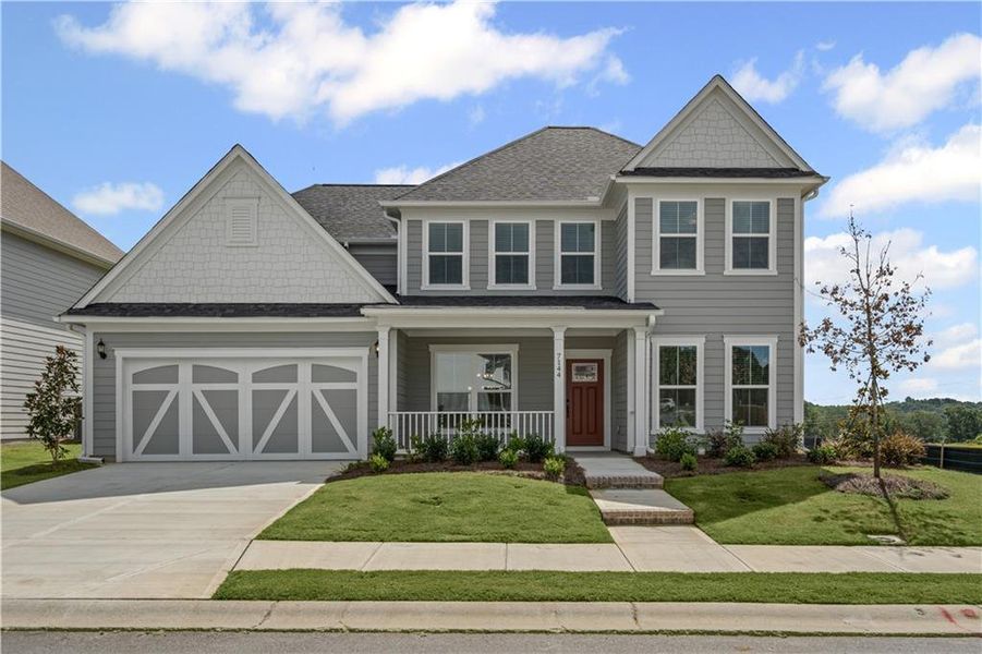 Front exterior of a new home in Reunion, Flowery Branch, GA, highlighting curb appeal (Image 23). Front exterior of a new home in Reunion, Flowery Branch, GA, highlighting curb appeal (Image 23).