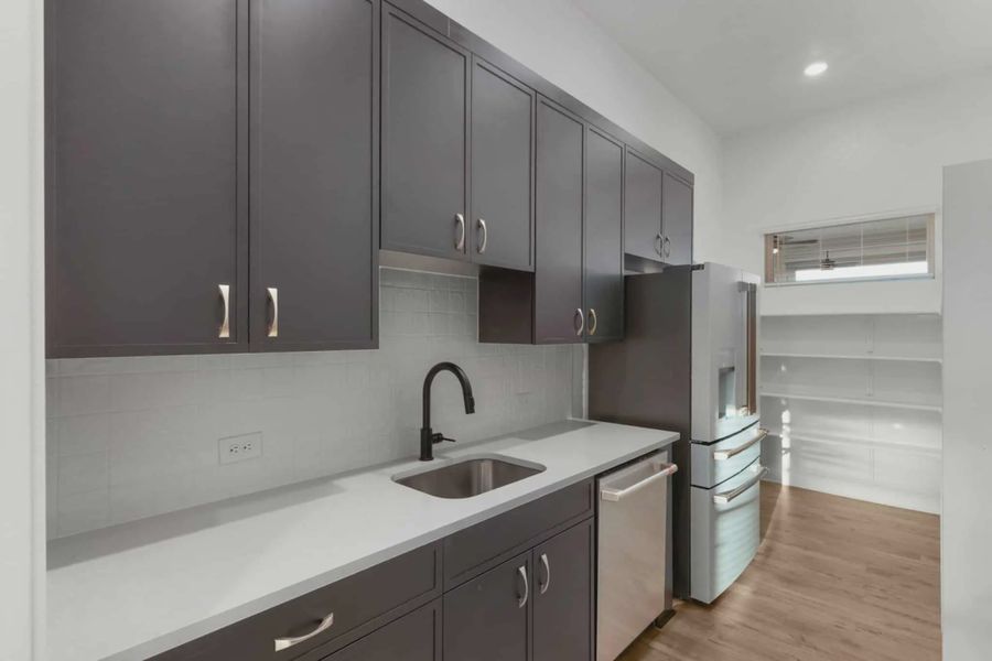 Representative furnished interior of a home built from the Merritt by Chesmar Homes in Feathergrass, Fulshear (Image 5).