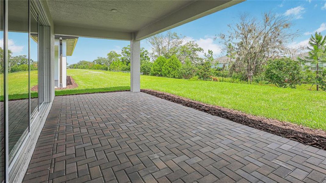 Exterior details and patio area of a home in Woodland Preserve, Parrish (Image 4).