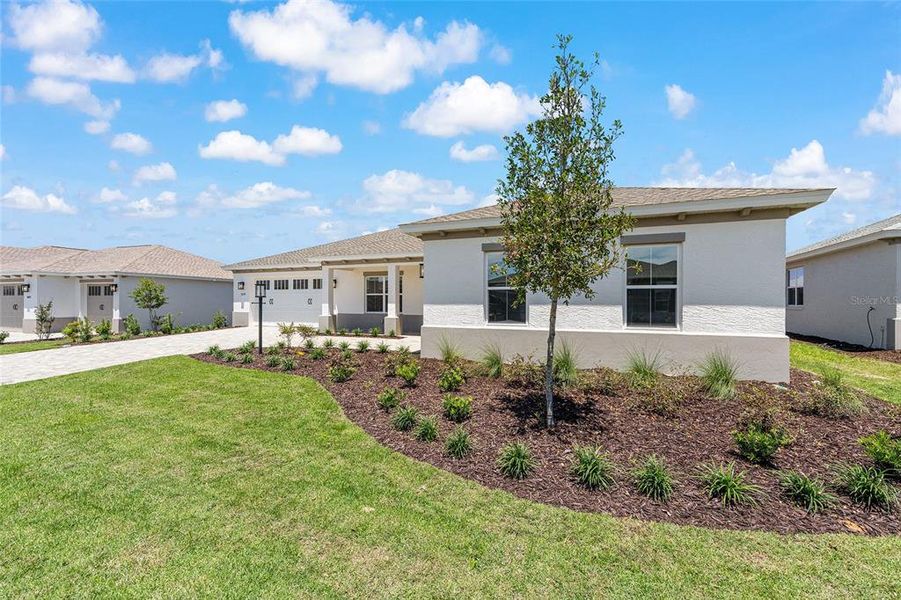 Front exterior of a new home in , Ocala, FL, highlighting curb appeal (Image 1). Front exterior of a new home in , Ocala, FL, highlighting curb appeal (Image 1).