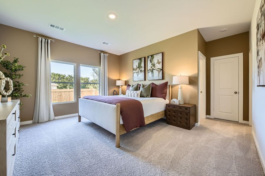 A bedroom with a large bed. A bedroom with a large bed.