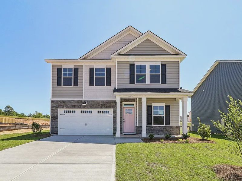 Front exterior of a new home in Providence Station at Trolley Run, Aiken, SC, highlighting curb appeal (Image 2). Front exterior of a new home in Providence Station at Trolley Run, Aiken, SC, highlighting curb appeal (Image 2).