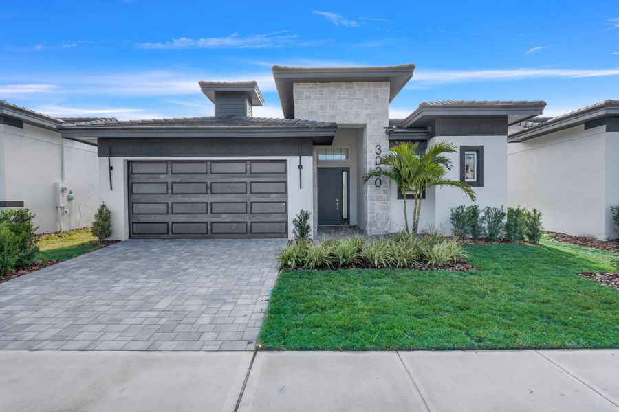 Representative exterior photo of a completed home built from the Courtyard 50 3BR by ABD Development in Hampton Green at Providence, Davenport, FL (Image 31).